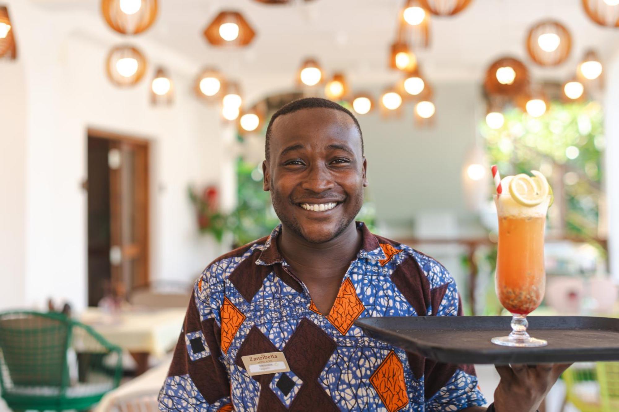 Zanzibella Hotel & Spa Kiwengwa  Ngoại thất bức ảnh A waiter at the Serena Hotel in Kampala, Uganda